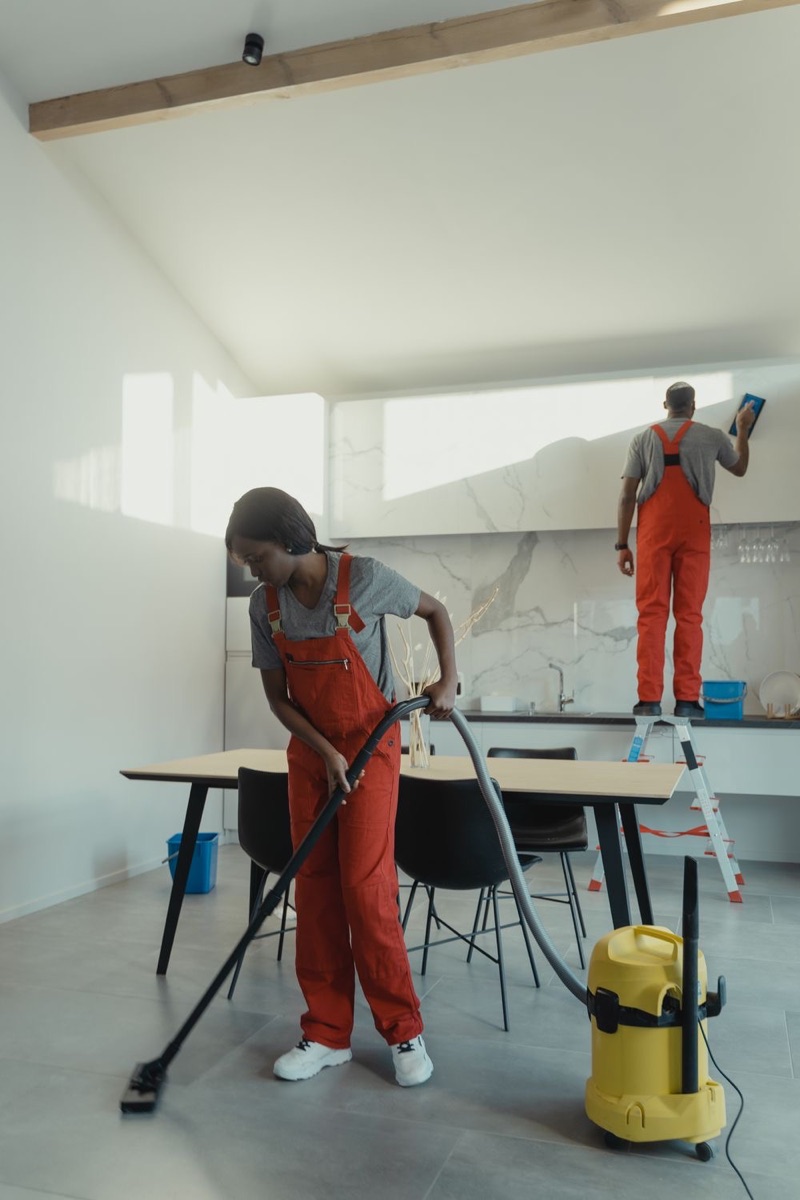 Professional cleaning team working together